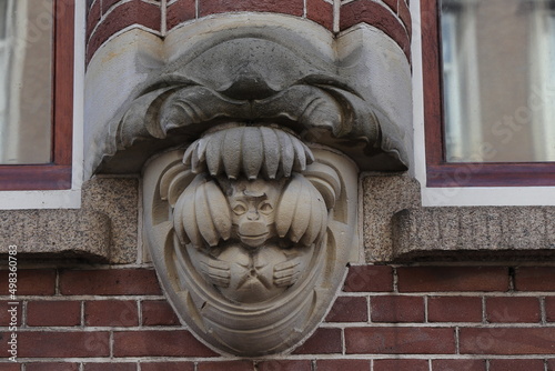 Amsterdam Spuistraat Street Building Exterior Sculpted Detail Depicting a Monkey with Bananas, Netherlands photo