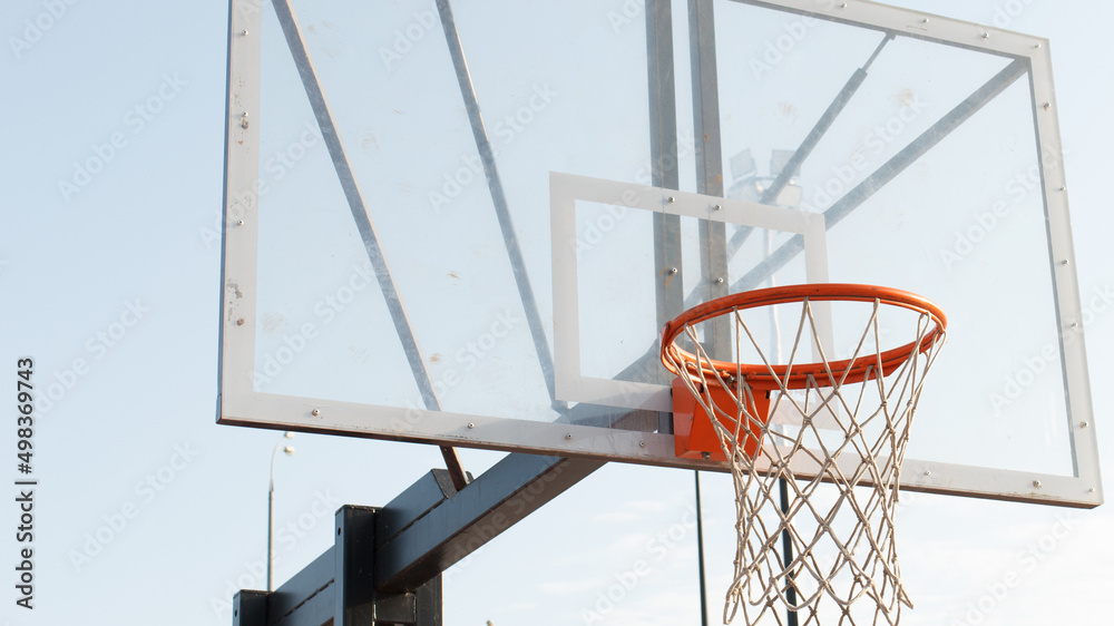 basketball hoop on a blue sky background on a clear summer day