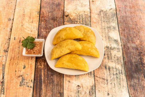 These typical Colombian ground beef empanadas have as a particularity their dough made with yellow corn flour. photo