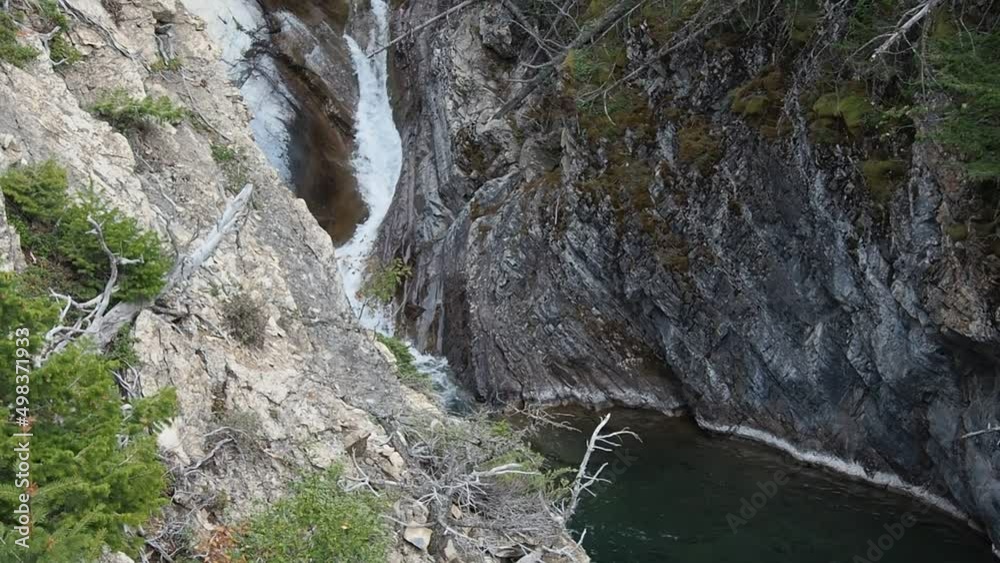 Hell Roaring Falls with a natural pool at Waterton Lake National Park Hell Roaring Falls with a natural pool at Waterton Lake National Park