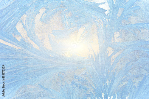 Ice patterns on glass, snow on the window, winter background