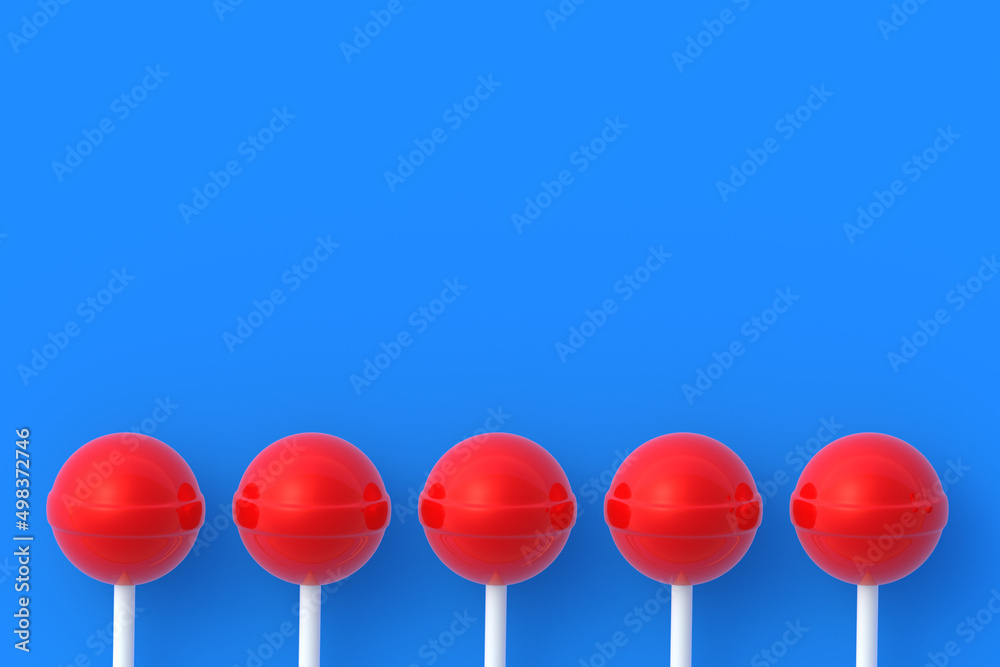 Row of lollipops on stick on blue background. Sweet candy. Confectionery goods. Top view. Copy space. 3d render Row of lollipops on stick on blue background. Sweet candy. Confectionery goods. Top view. Copy space. 3d render