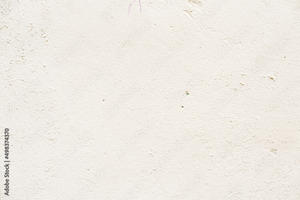 Light painted concrete wall, natural rough texture Light painted concrete wall, natural rough texture