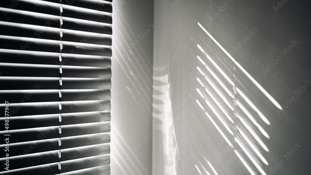 Obraz premium Architectural shadows. Sunlight architecture abstract background with light, black shadow overlay from window on white texture wall. Mockups, posters, stationary, wall art, design presentation.