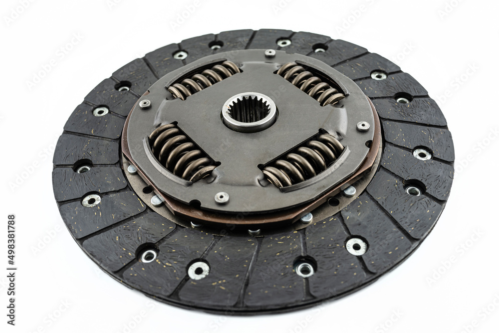 Naklejka premium Used car clutch with damper springs and friction linings, isolated on a white background.