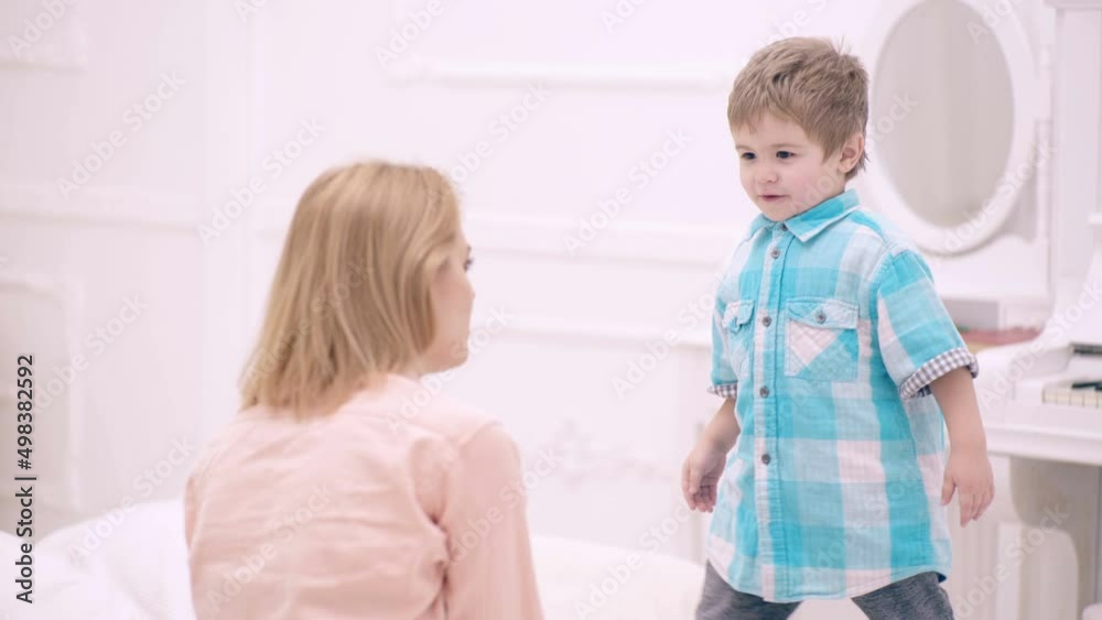 Mother and child son play in bed. Mom and child talking in bedroom. Mother and child son play in bed. Mom and child talking in bedroom.