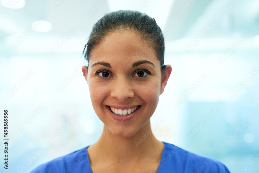 Here to help you heal. Portrait of a confident young nurse smiling in the clinic.