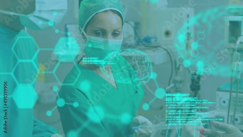 Wallpaper Mural Animation of brain scan and medical data processing over surgeons operating on patient in theatre Torontodigital.ca