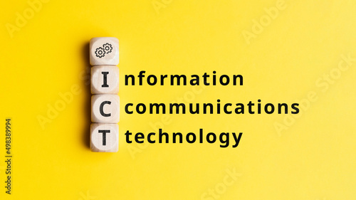 Acronym ICT or Information and communications technology. Text on cubes