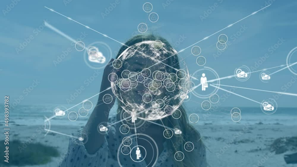 Animation of network of connections with media icons over happy caucasian woman at beach Animation of network of connections with media icons over happy caucasian woman at beach