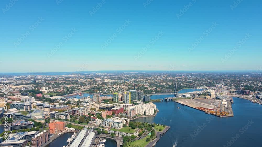 Aerial drone view of Anzac Bridge turning toward Sydney's Darling Harbour on a sunny day Aerial drone view of Anzac Bridge turning toward Sydney's Darling Harbour on a sunny day