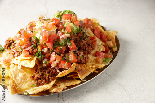 Beef nachos on plate photo