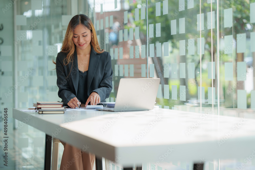 Modern Asian Business woman have confident working with financial at office. Accounting concept. Modern Asian Business woman have confident working with financial at office. Accounting concept.