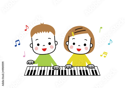 ピアノを仲良く連弾している男の子と女の子