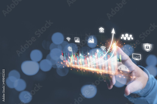 Fototapeta Naklejka Na Ścianę i Meble -  Hand of businessman touching pointing virtual screen on growth graph business with copy space. Investment stock market traded graph financial for-profit corporate in the future. Funds, digital assets.
