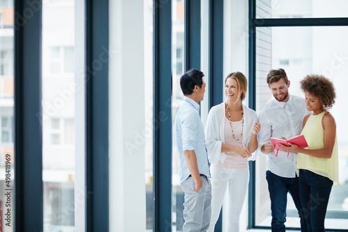 Good communication is the heart of a great team. Shot of a group of colleagues having a conversation in the office. Free Download Good communication is the heart of a great team. Shot of a group of colleagues having a conversation in the office. - GFXLoad