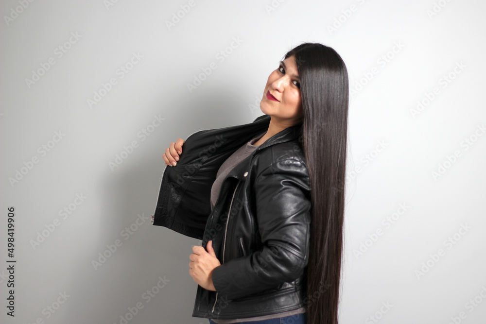 Fat latin young adult woman shows off her beautiful very long straight black shiny silky hair wears black fur jacket looks modern, happy and full body positive
Fat latin young adult woman shows off her beautiful very long straight black shiny silky hair wears black fur jacket looks modern, happy and full body positive