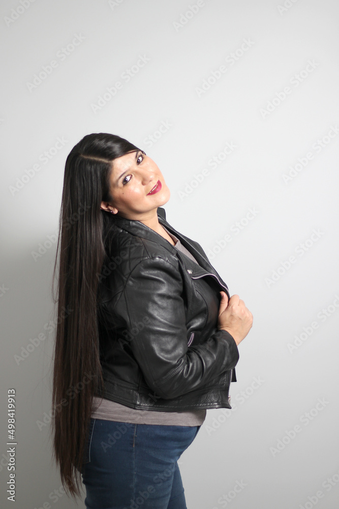 Fat latin young adult woman shows off her beautiful very long straight black shiny silky hair wears black fur jacket looks modern, happy and full body positive
Fat latin young adult woman shows off her beautiful very long straight black shiny silky hair wears black fur jacket looks modern, happy and full body positive