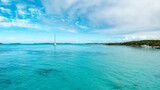 sail boat bahamas blue green water beach island