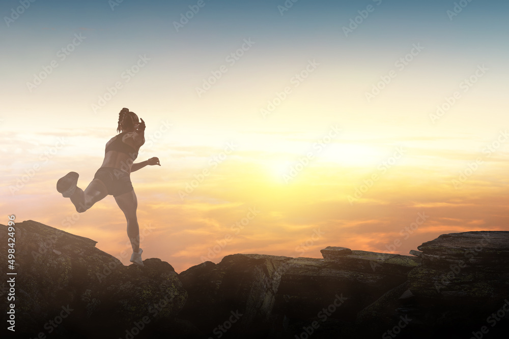 Woman running against sunset sky