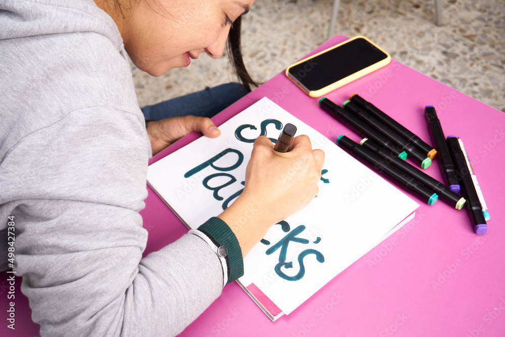 woman drawing a poster woman drawing a poster