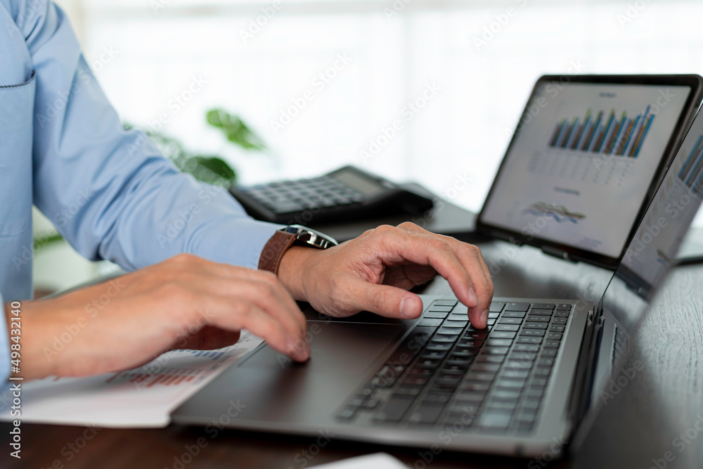 Close up businessman hand using laptop for work. business hands pressing on laptop keyboard. Close up businessman hand using laptop for work. business hands pressing on laptop keyboard.