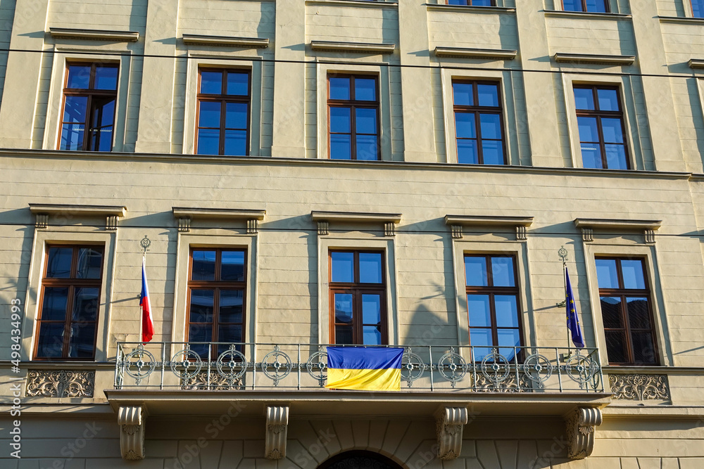 Ukrainian flag hung on the balcony of one of the houses in Prague on Republic Square in Czech Republic. High quality photo
