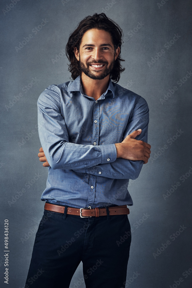 Obraz premium Theres something majestic about this picture. Studio portrait of a handsome young man standing with his arms folded against a grey background.