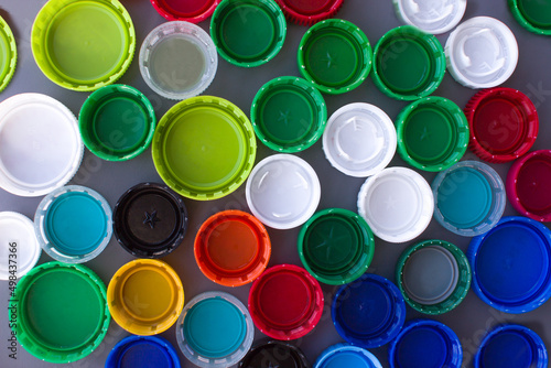 Plastic bottle caps. Collection of material for processing. Background image.