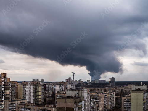 A cloud of smoke after a rocket attack. View from a window in Kyiv on Irpin, Bucha and Gostomel.