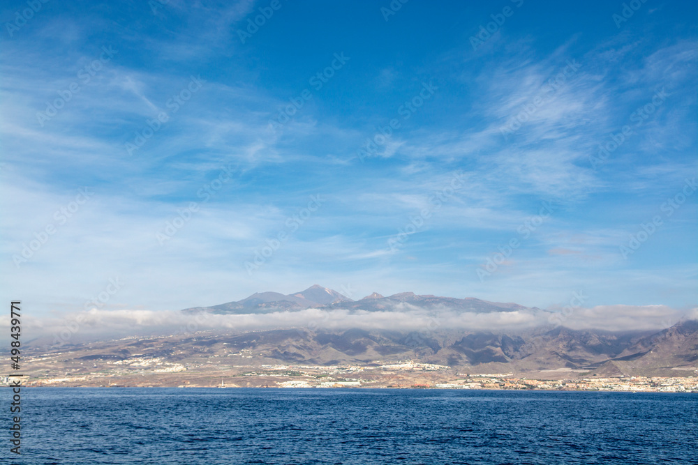 View on resorts and beaches of South coast of Tenerife island during sail boat trip along coastline, Canary islands, Spain View on resorts and beaches of South coast of Tenerife island during sail boat trip along coastline, Canary islands, Spain