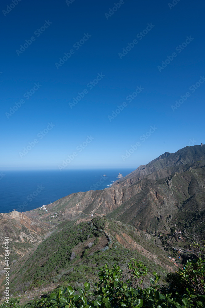Panoramic view on green mountains and blue Atlantic ocean, Anaga national park near Tanagana village,  North of Tenerife, Canary islands, Spain
