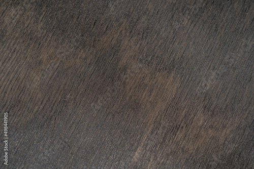 A sheet of plywood covered with dark oil. close-up texture.