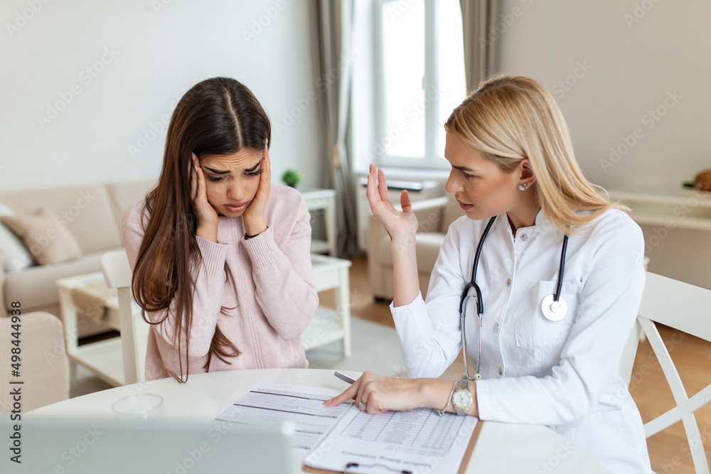 Fototapeta premium Patient receiving bad news, She is desperate and crying, Doctor support and comforting her patient with sympathy. Don't worry, this medical test is not so bad
