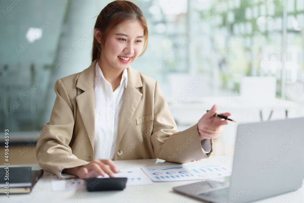 Data analysis, roadmap, marketing, accounting, auditing. Portrait of Asian businesswoman using computer in video conferencing, presenting marketing plan using statistical data sheet at work. Data analysis, roadmap, marketing, accounting, auditing. Portrait of Asian businesswoman using computer in video conferencing, presenting marketing plan using statistical data sheet at work.