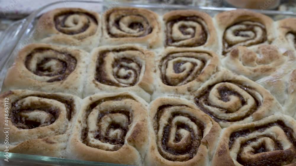 Overhead view of freshly baked cinnamon rolls hot from the oven Overhead view of freshly baked cinnamon rolls hot from the oven
