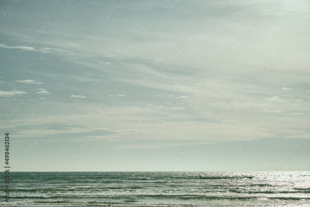 Sea on sunny, cloudy sky background. Beautiful cloudy spring sky on a bright sunny day. Turquoise afternoon on the sandy beach of the Black Sea. High quality photo Sea on sunny, cloudy sky background. Beautiful cloudy spring sky on a bright sunny day. Turquoise afternoon on the sandy beach of the Black Sea. High quality photo