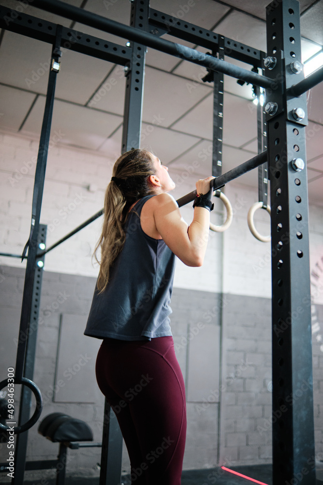Young fitness woman training at the gym Young fitness woman training at the gym