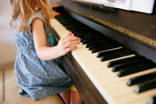 The next Mozart in the making. Cropped shot of a little girl playing the piano.