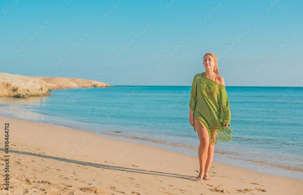 Summer season, vacation at sea, ocean. Woman take a rest on shore. Pretty nice landscape view