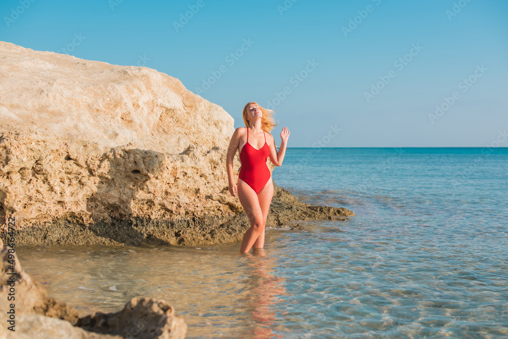Summer season, vacation at sea, ocean. Woman take a rest on shore. Pretty nice landscape view