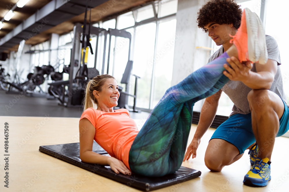 Portrait of happy fit people, friends exercising in gym together. Sport people workout concept Portrait of happy fit people, friends exercising in gym together. Sport people workout concept