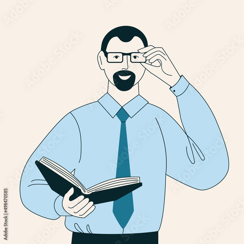 Man in shirt and tie holding a book