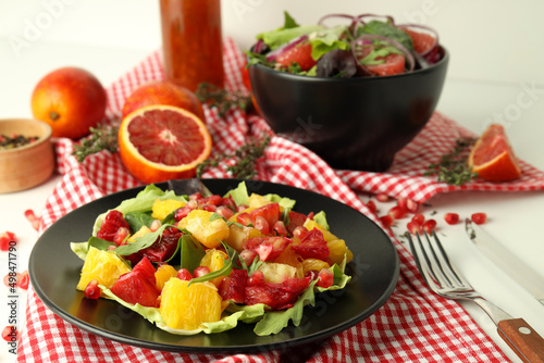 Concept of tasty food, salad with red orange, close up