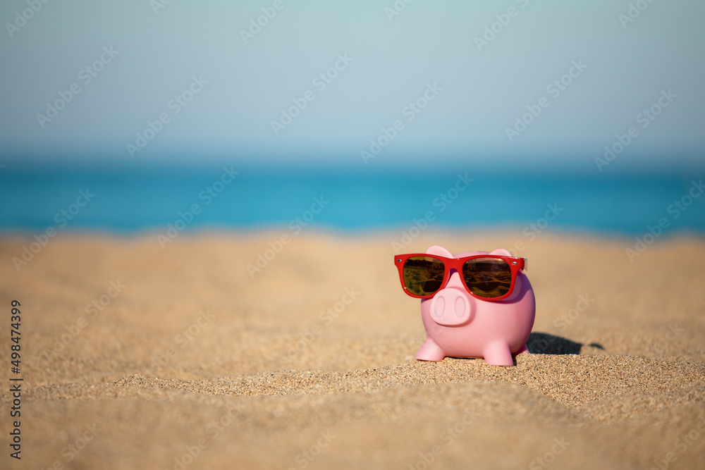 Piggybank on the beach in summer