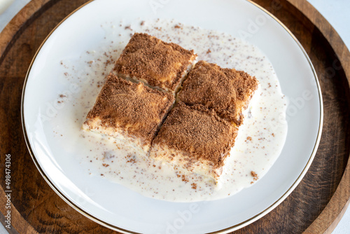 Cold baklava on a white background. Baklava with pistachio milk. Traditional Turkish cuisine delicacies. The new trend is baklava. close-up. local name soguk baklava photo