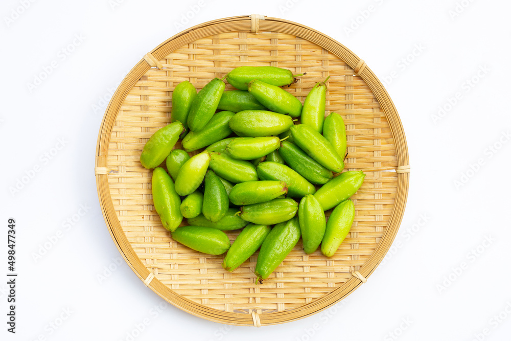 Bilimbi fruit in bamboo basket on white background. Bilimbi fruit in bamboo basket on white background.