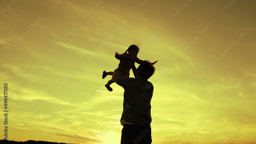 happy family concept. father plays with small child flying airplane pilot. happy family park. daddy kid superhero flies against sky. day off daughter child with dad. childhood dream to fly outdoors.