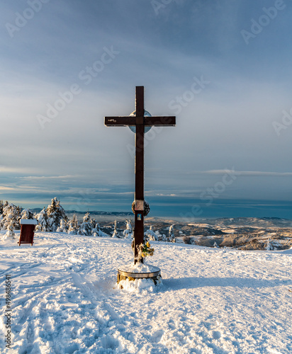 Cross on Velka Raca hill sumit in winter Kysucke Beskydy ountains on slovakian - polish borders photo