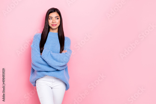 Portrait of attractive cheery minded brunet girl thinking copy space folded arms isolated over pink pastel color background